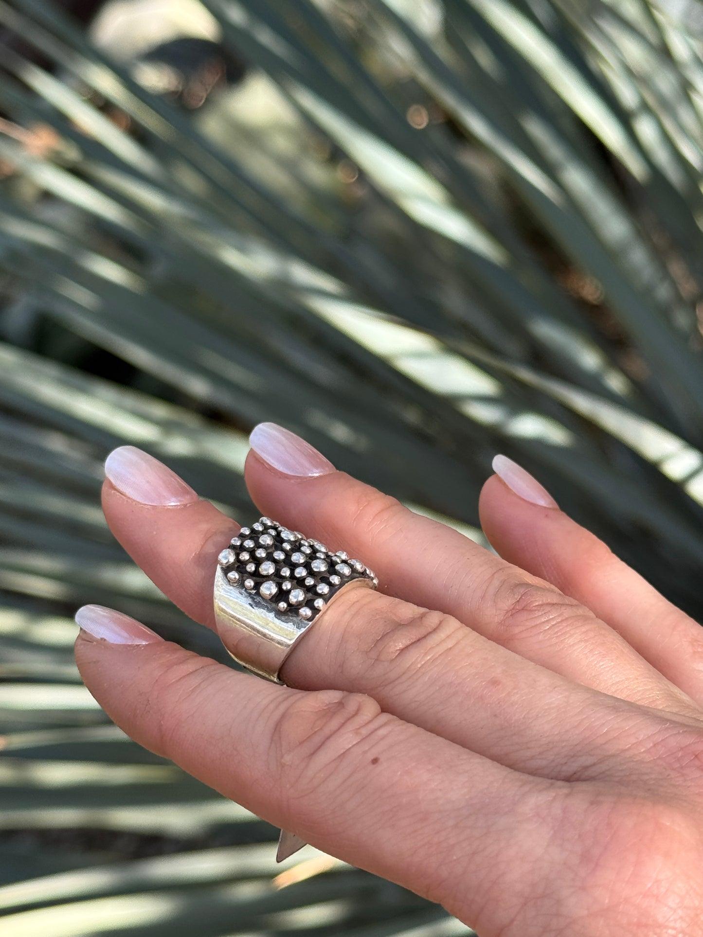 Sterling silver drop ring by Raymond Coriz, size 6