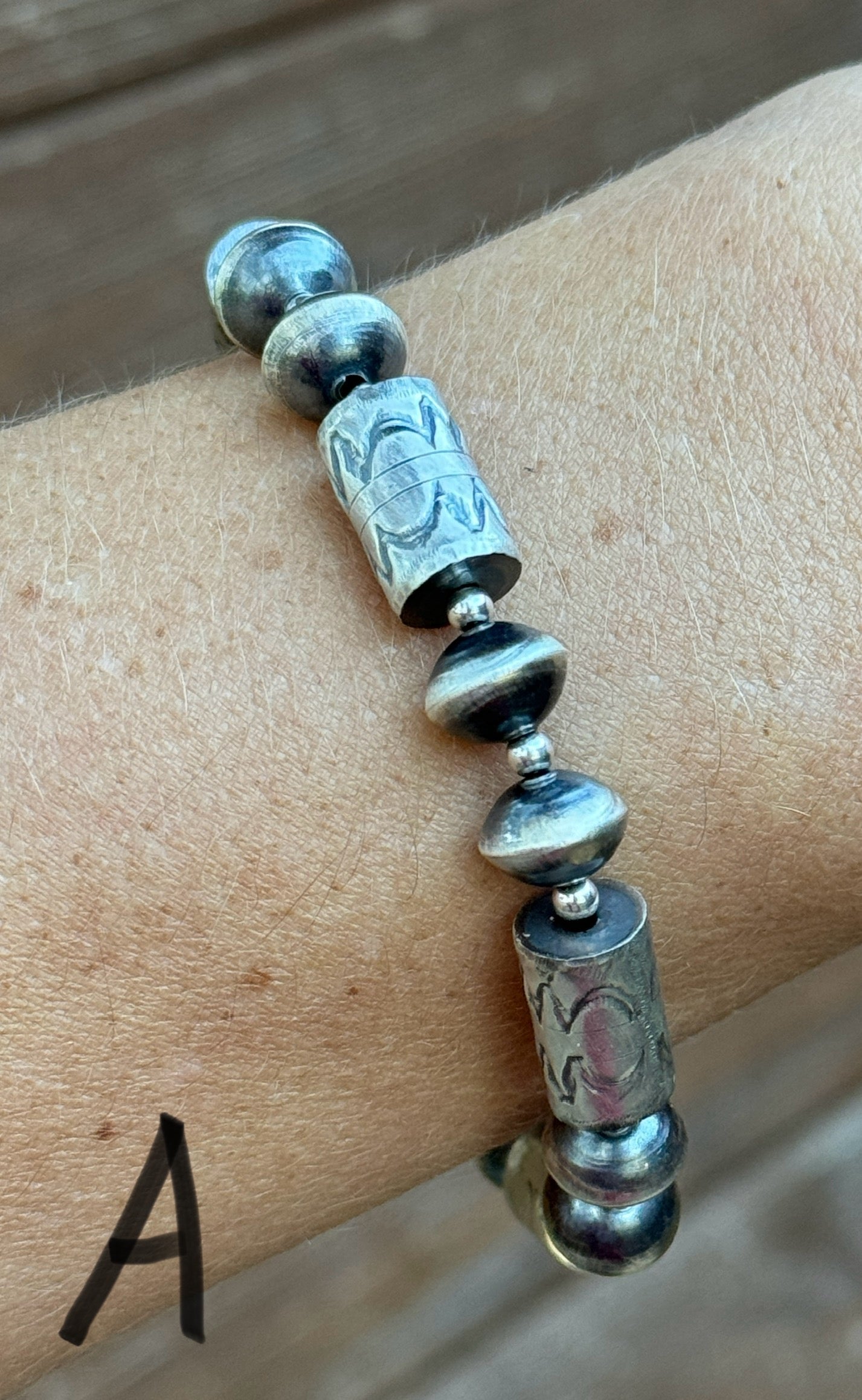 Sterling silver Navajo style beaded bracelet with stamped barrel beads