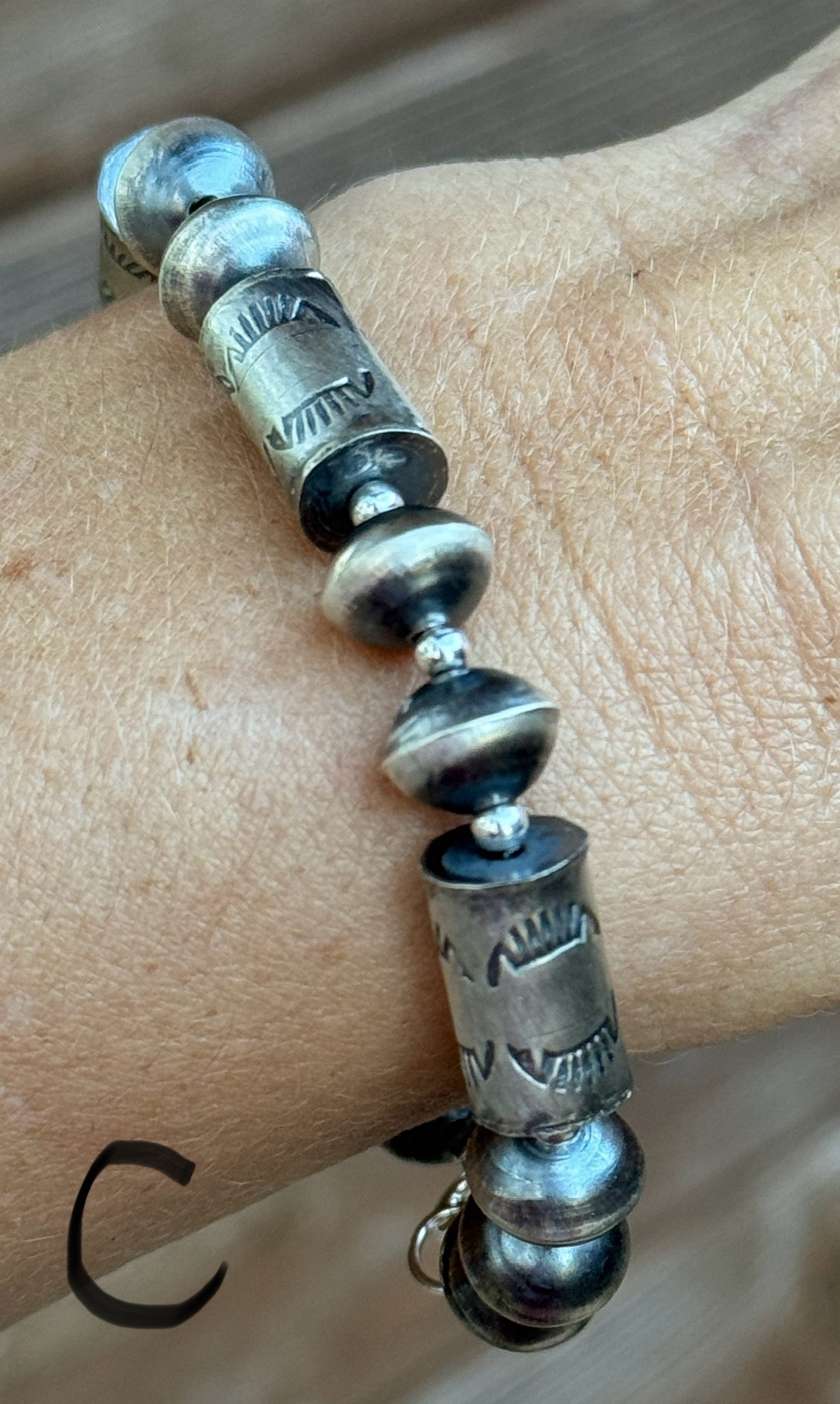 Sterling silver Navajo style beaded bracelet with stamped barrel beads