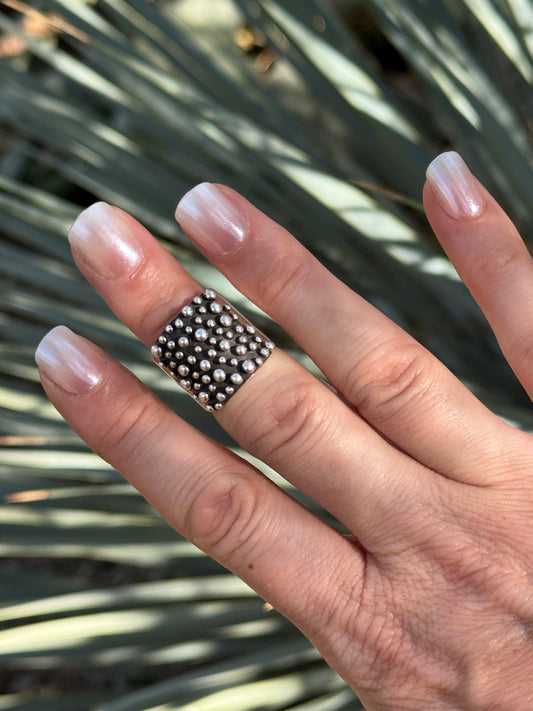 Sterling silver drop ring by Raymond Coriz, size 6