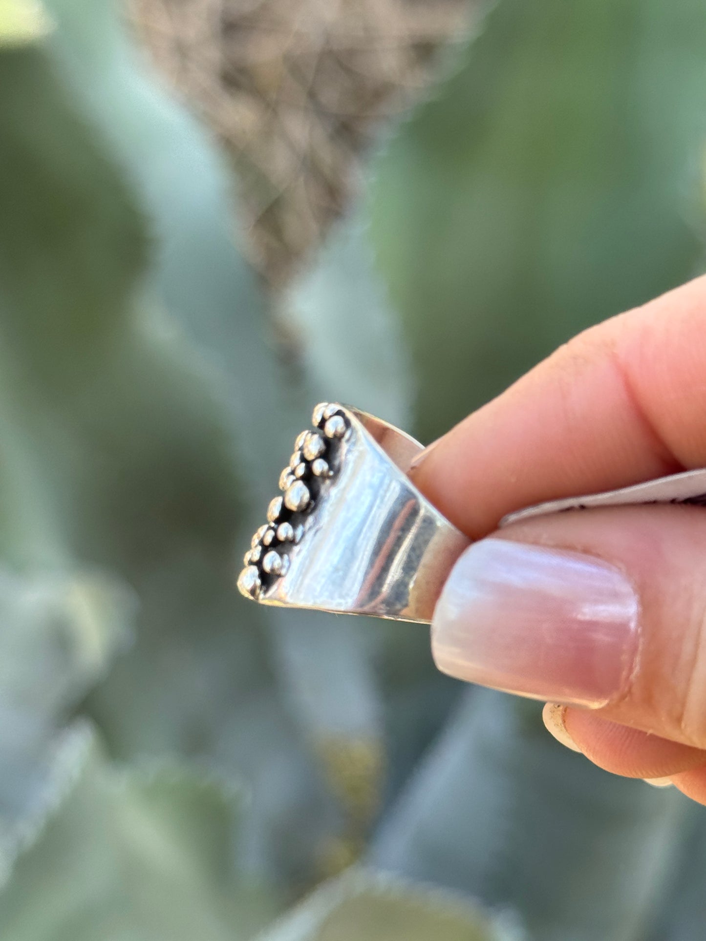 Sterling silver drop ring by Raymond Coriz, size 6