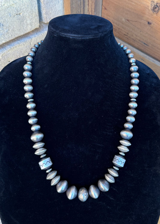 Stamped saucer Navajo pearls by Rose Martin