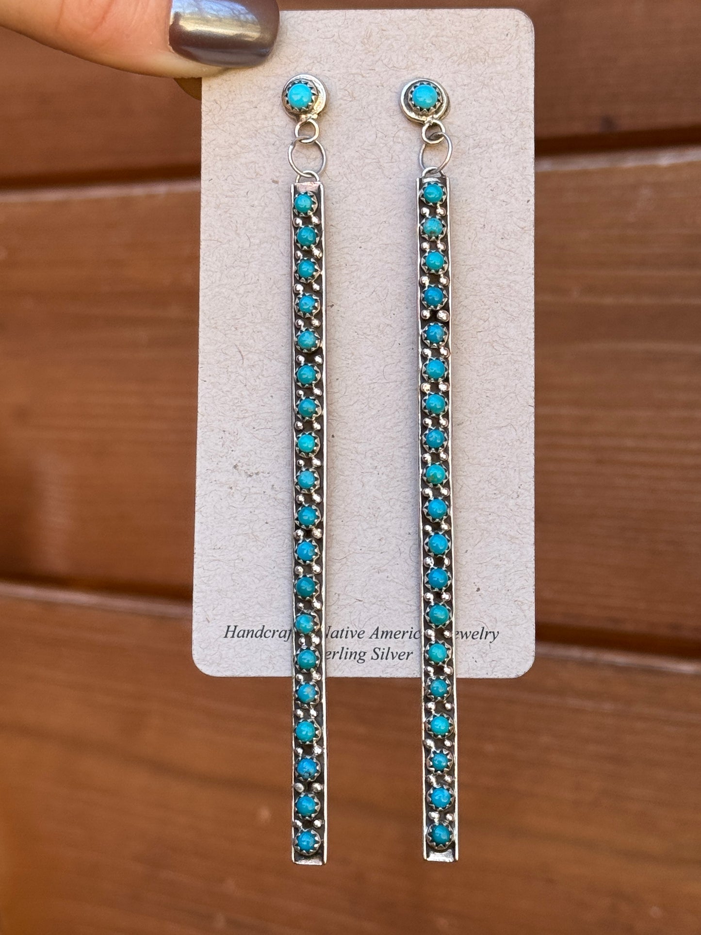 4 5/8” long, 20 stone dangle snake eye earrings