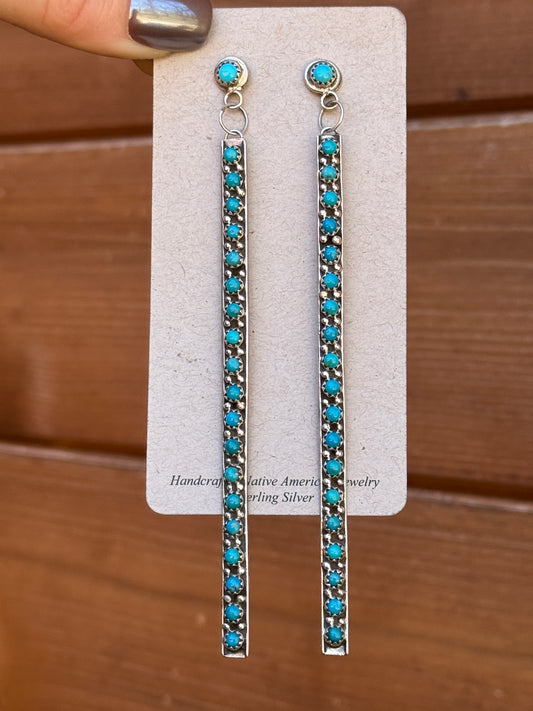 4 5/8” long, 20 stone dangle snake eye earrings